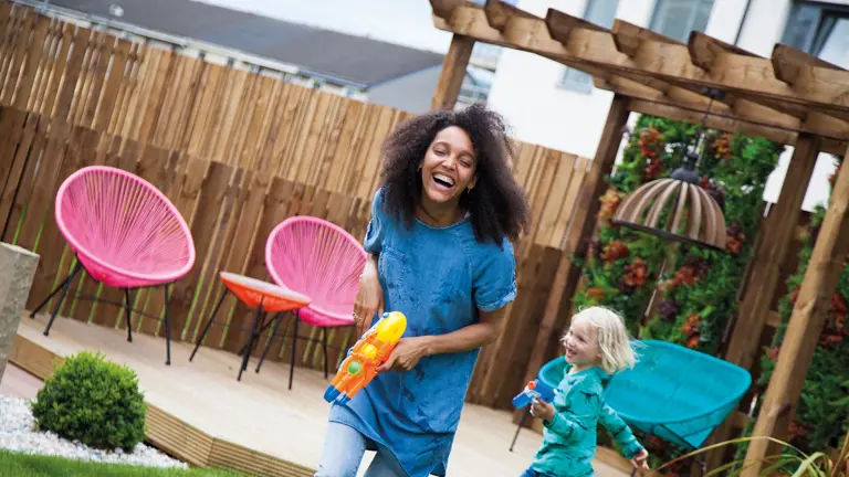 Woman and child playing in garden