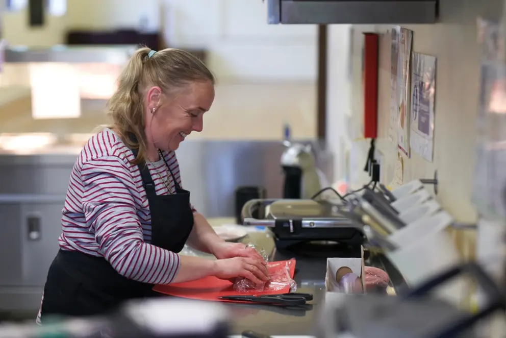 Woman Preparing Food In Kitchen